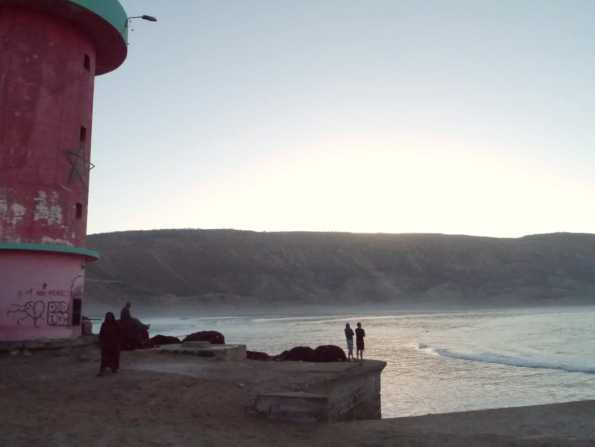 The lighthouse at dusk above Imsouane bay
